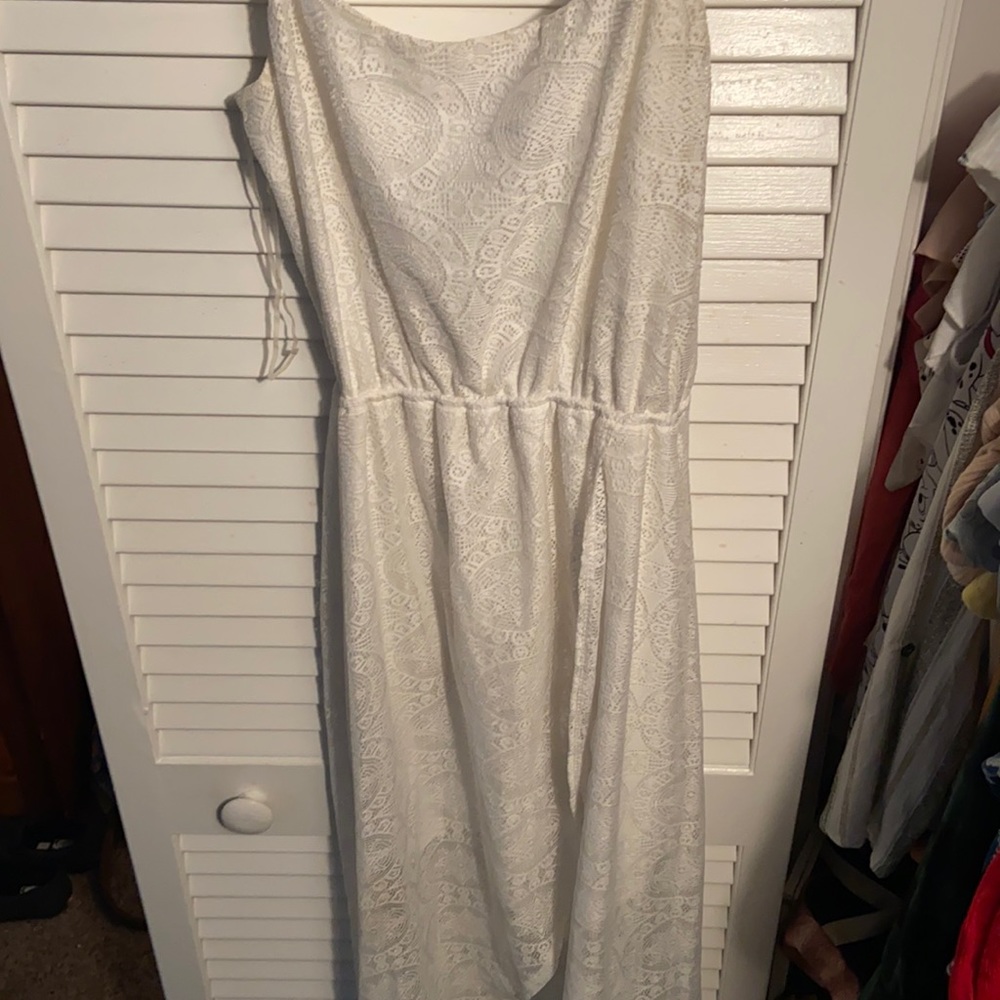 White Lacey spaghetti strap dress. Short in the front long in the back.